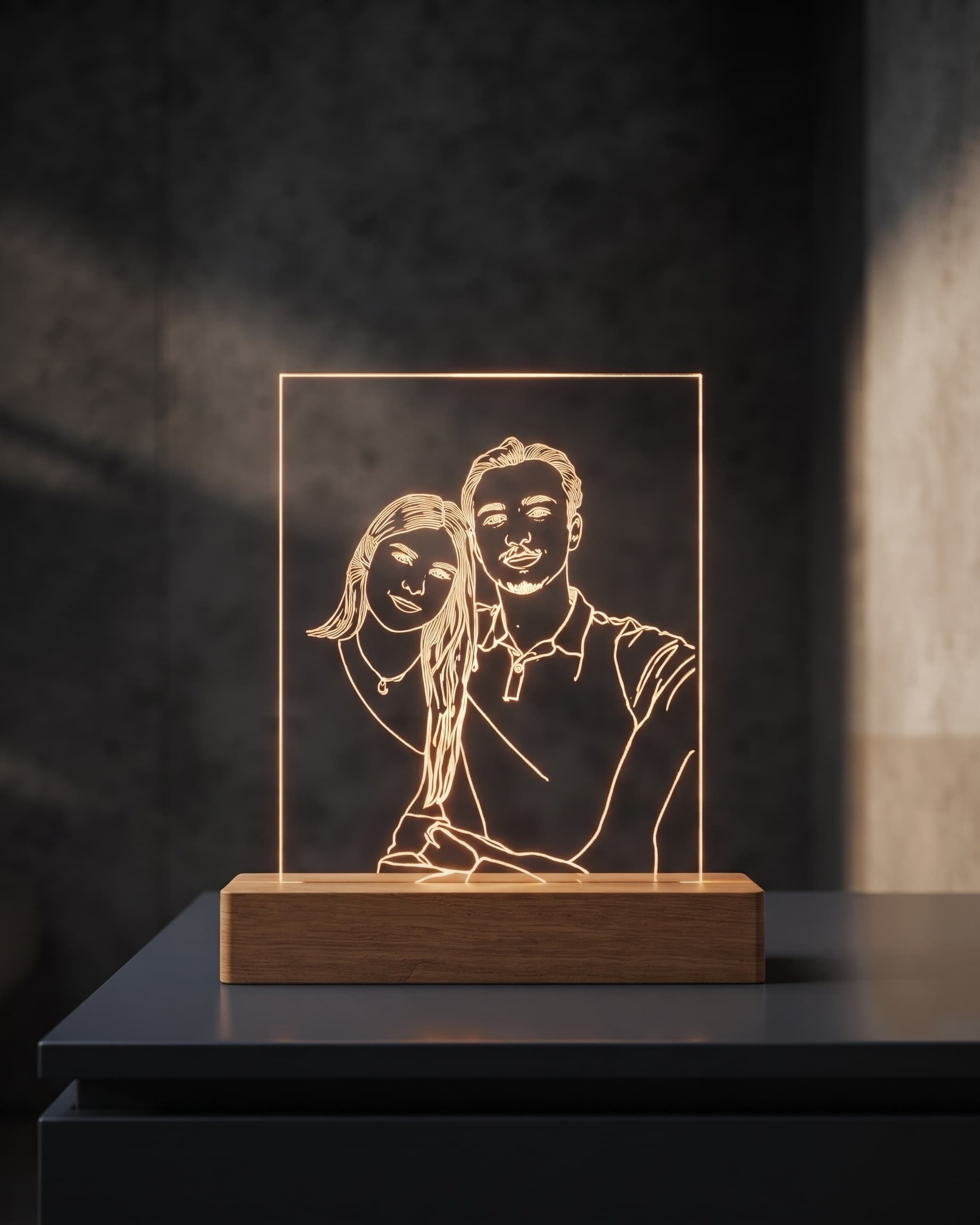 Portrait of a couple engraved on an illuminated LED plate